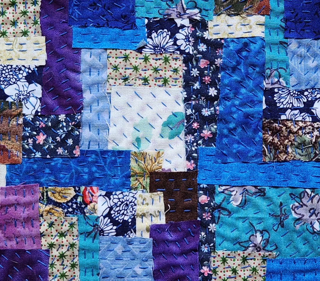 Sampler of Boro - small pieces of recycled fabric stitched together to create a while
